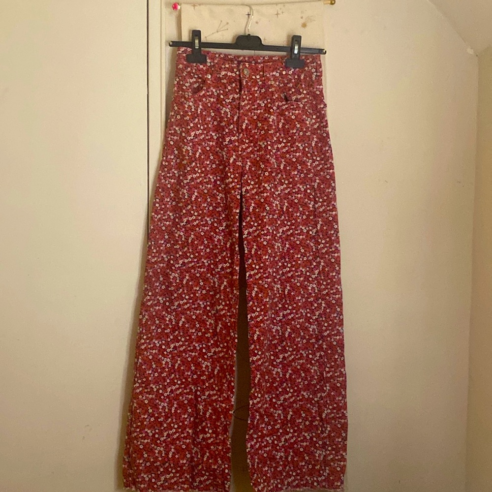 H&M straight legged, high waisted pink floral jeans.